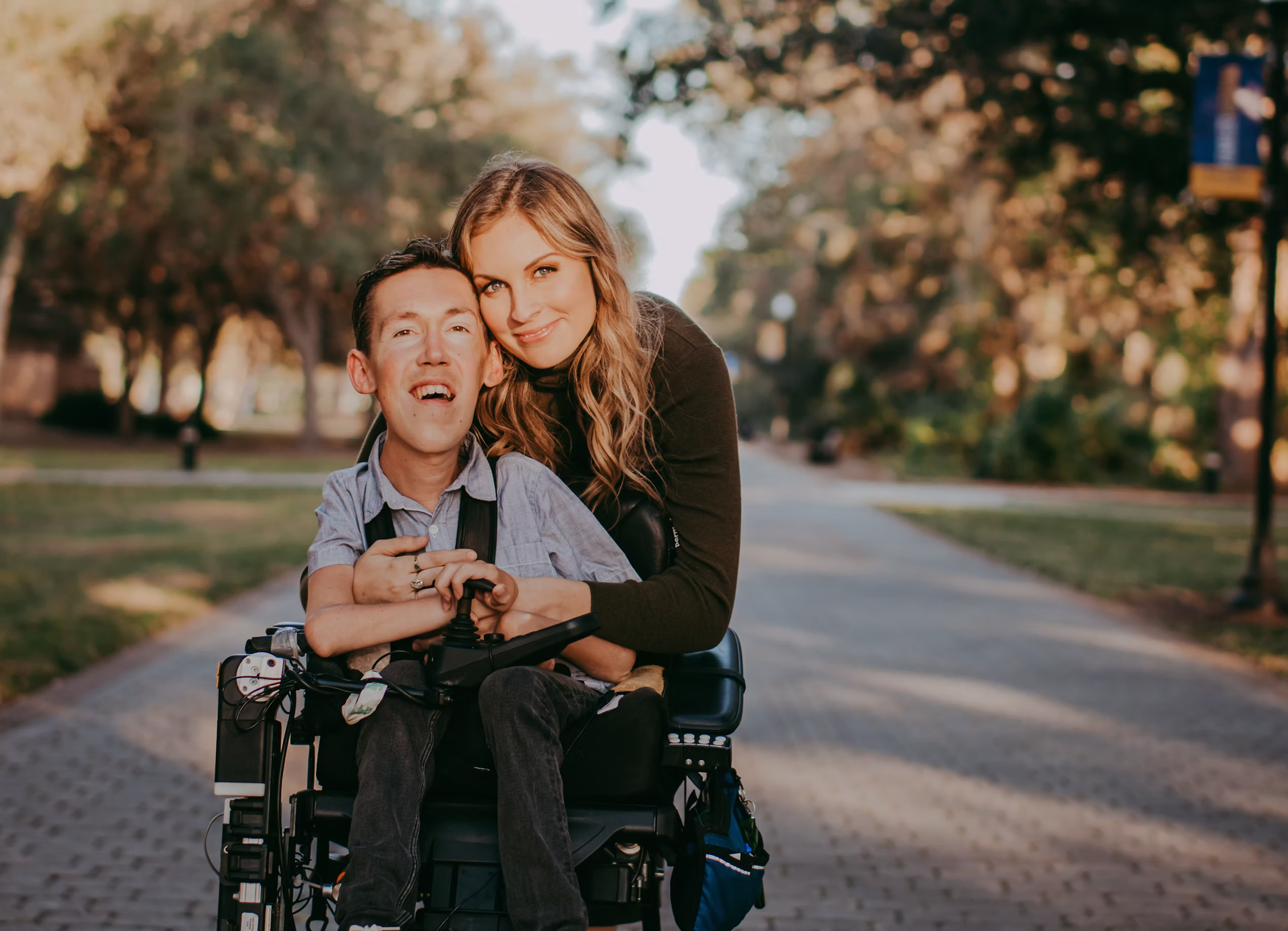 A sunset picture of Shane and Hannah Burcaw