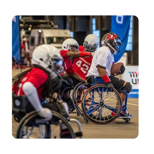 several players participate in a wheelchair football match