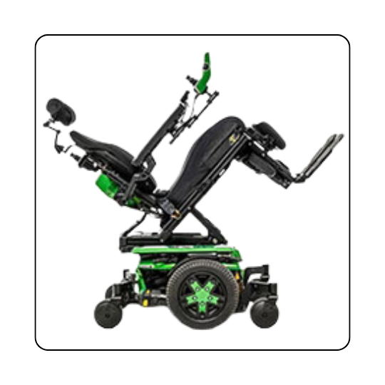 A black Quantum Rehab with green accents is in the tilted back back position.