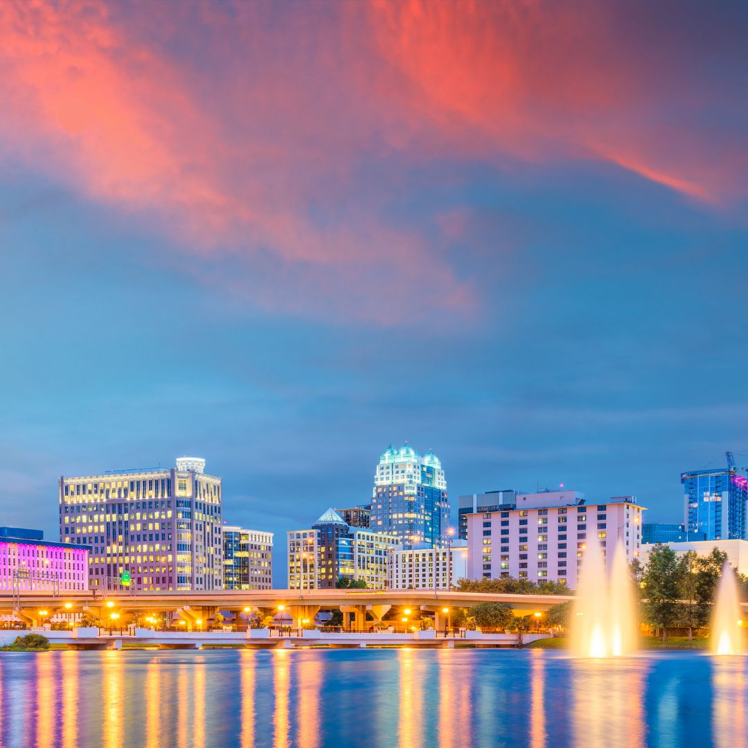 Colorful cityscape of Orlando at sunset.