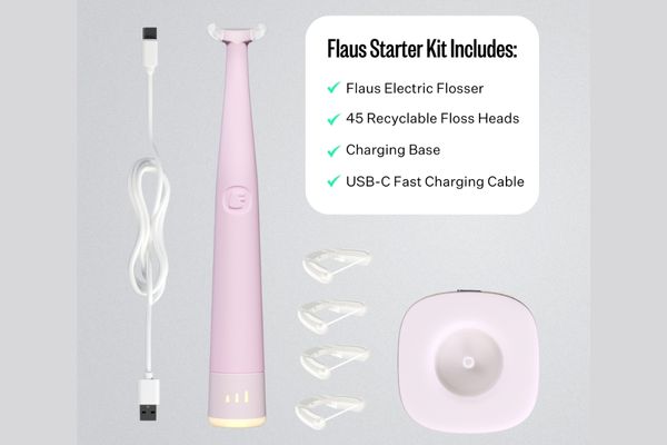 A pink Woven electric flosser is shown