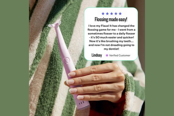 Lindsay is holding a pin Flaus Electric Flosser. Aquote from her touting the benefits of the device is included.