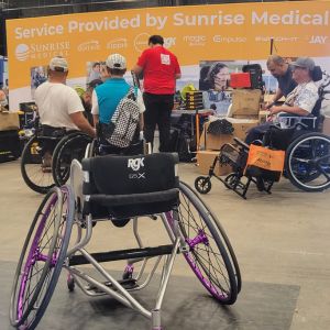It's the Sunrise Medical Wheelchair Repair Pavilion at Abiliteis Expo! There is an RGK wheelchair front and center with the repair station in the background.