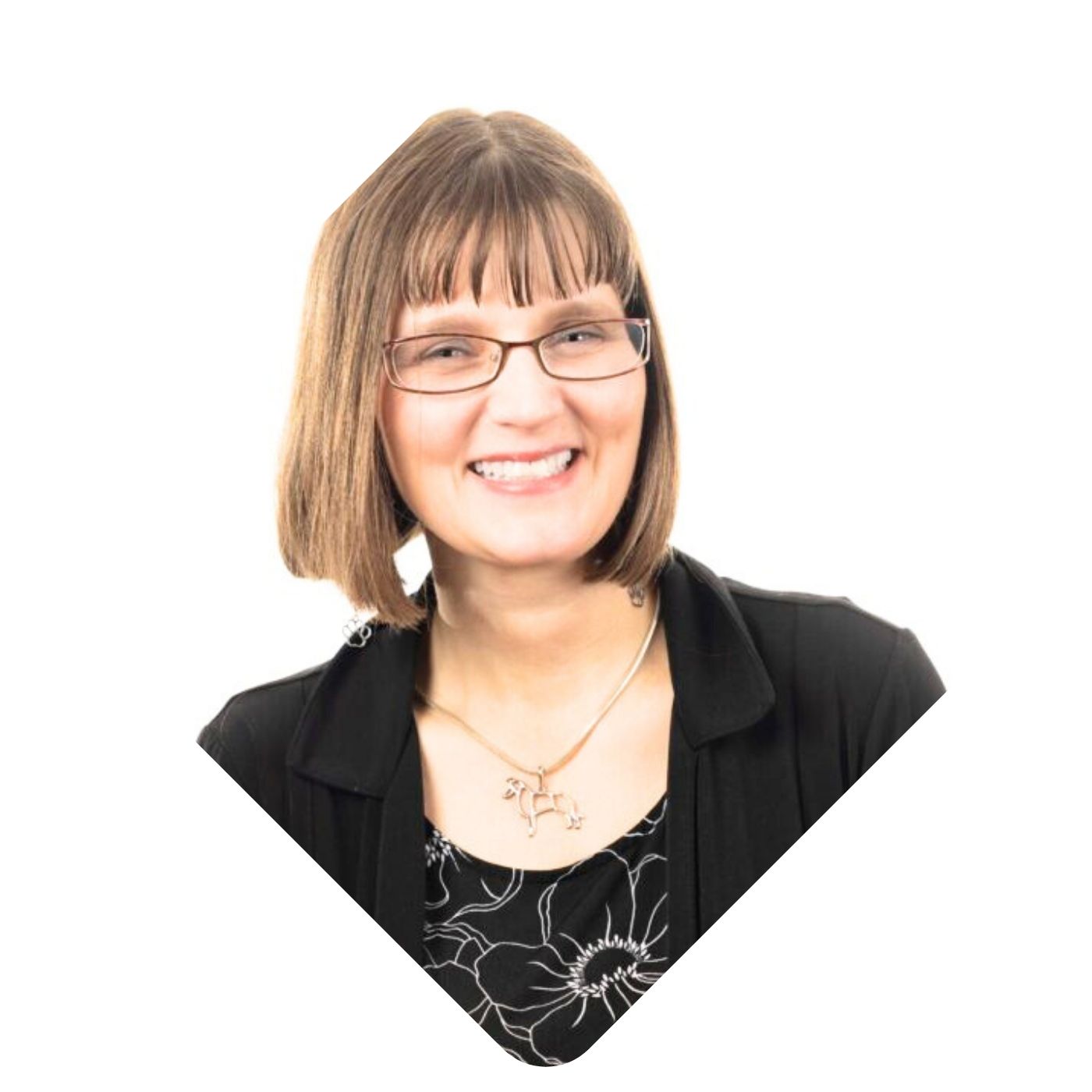 A smiling picture of Kristin Hartness is shown