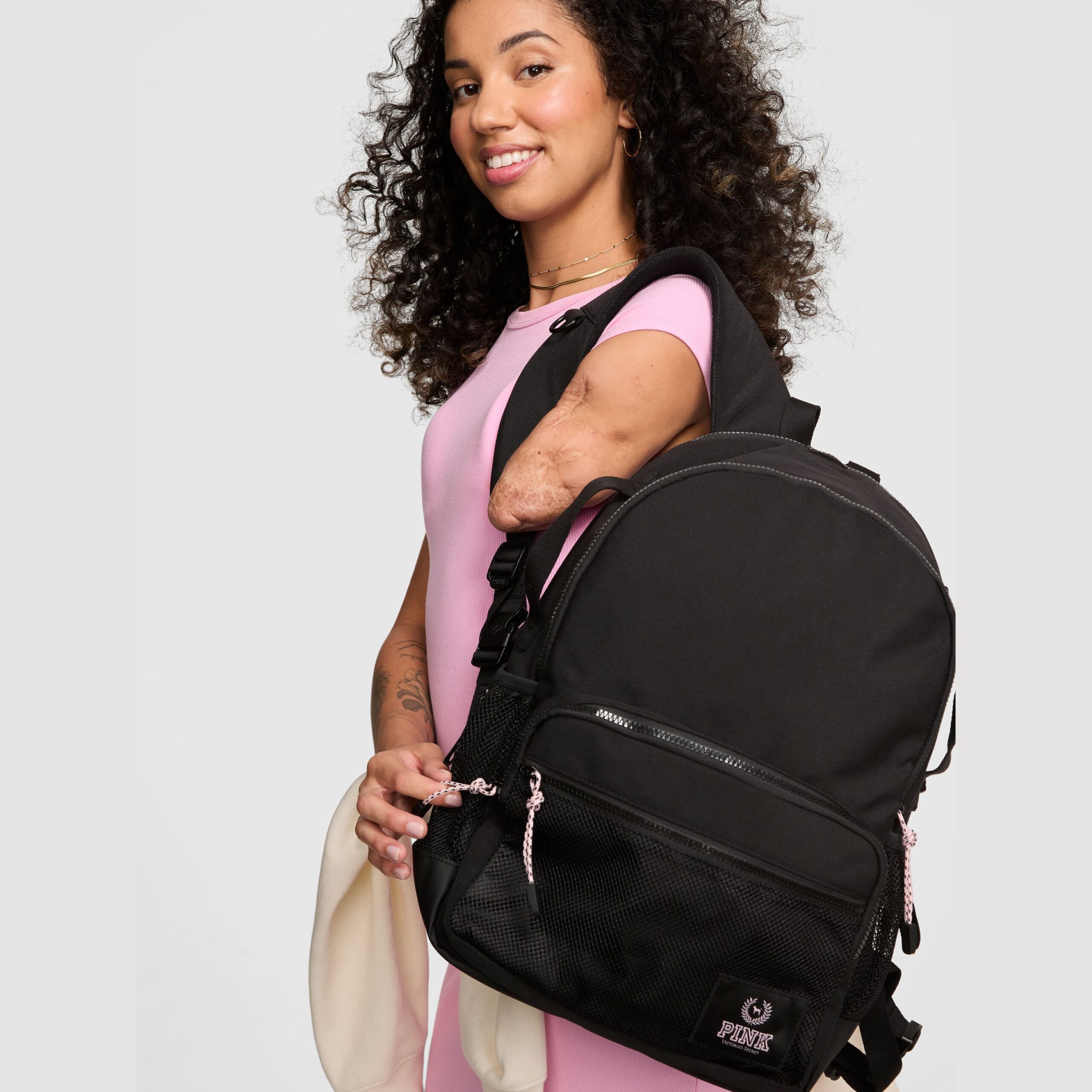 A woman with limb differences models Victoria Secret.