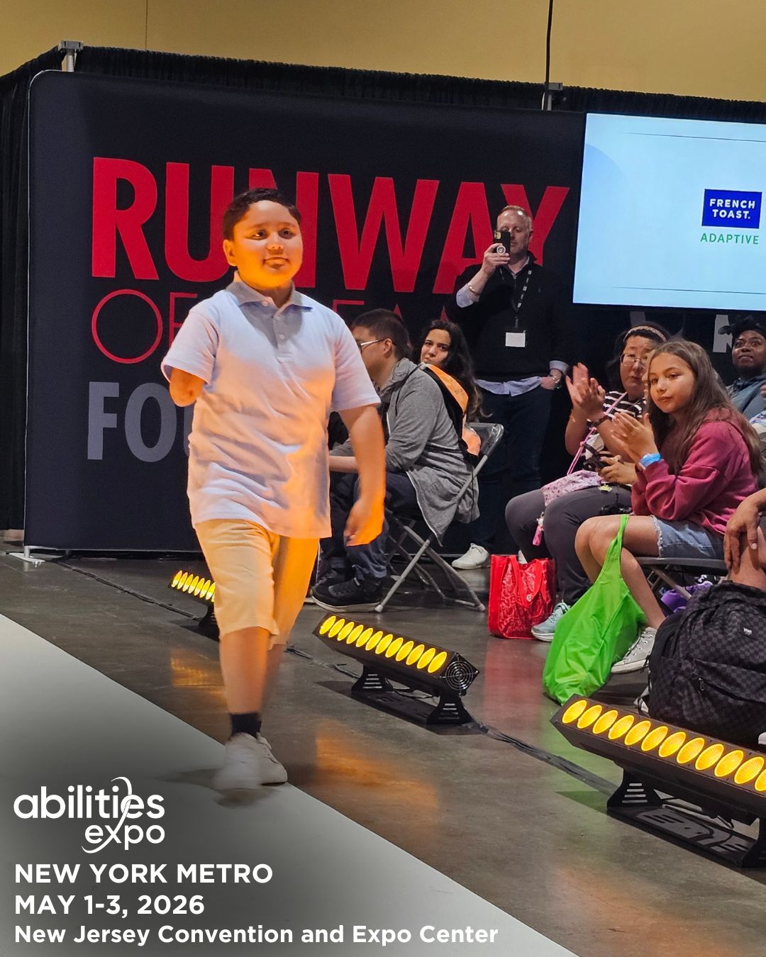A young boy models adaptive fashion on the Runway of Dreams