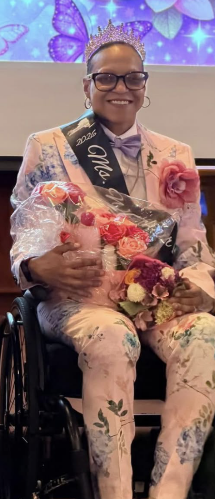 Shot of Gesy Duran in pink floral suit