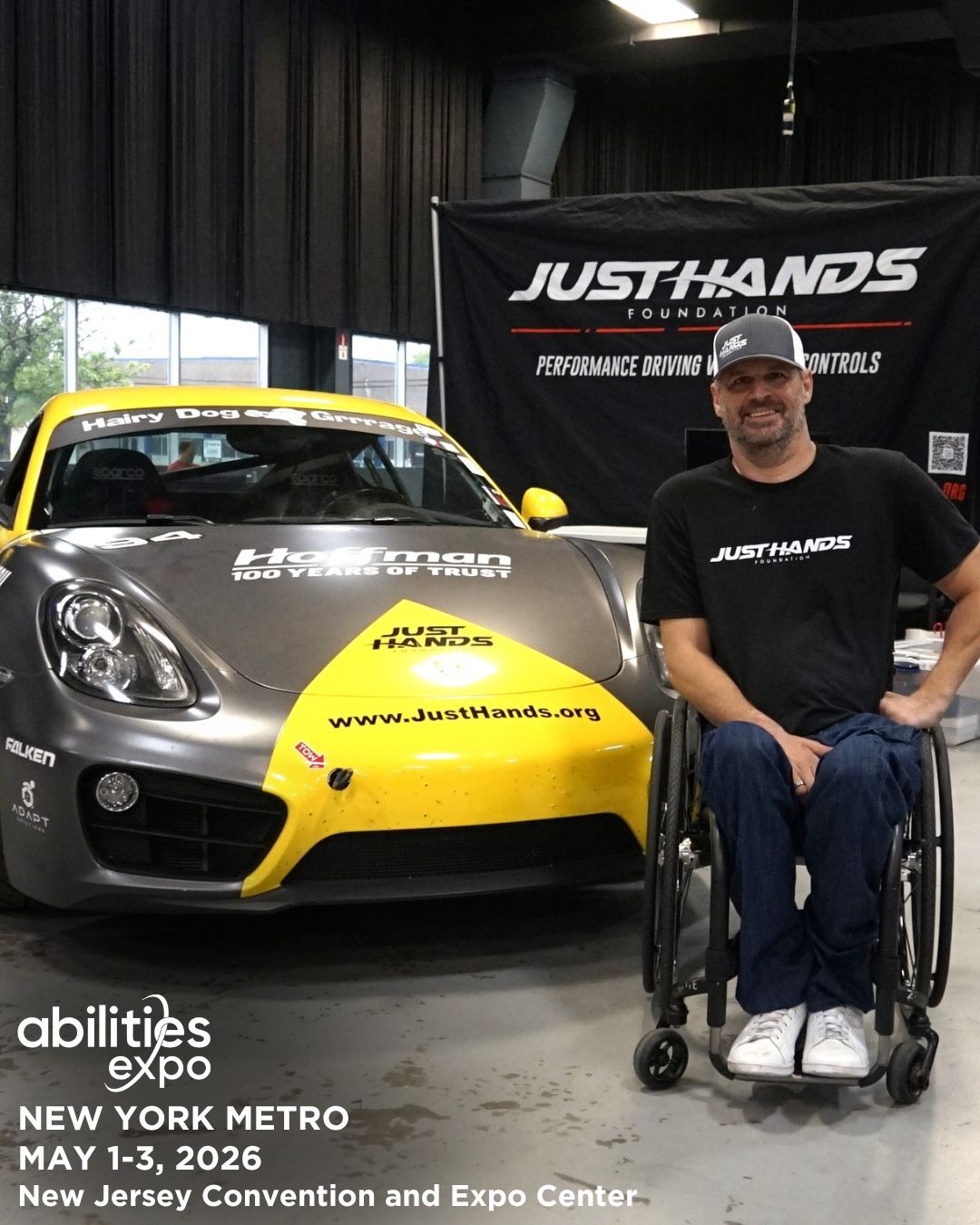 Trosten Gross from the JustHands Foundation poses with one of his adaptive race cars at an Abilities Expo