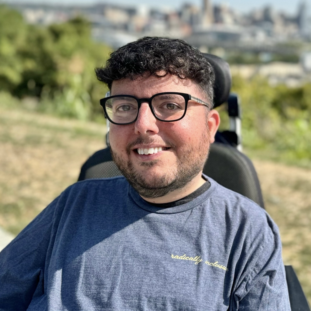 Headshot of a smiling Cory Lee