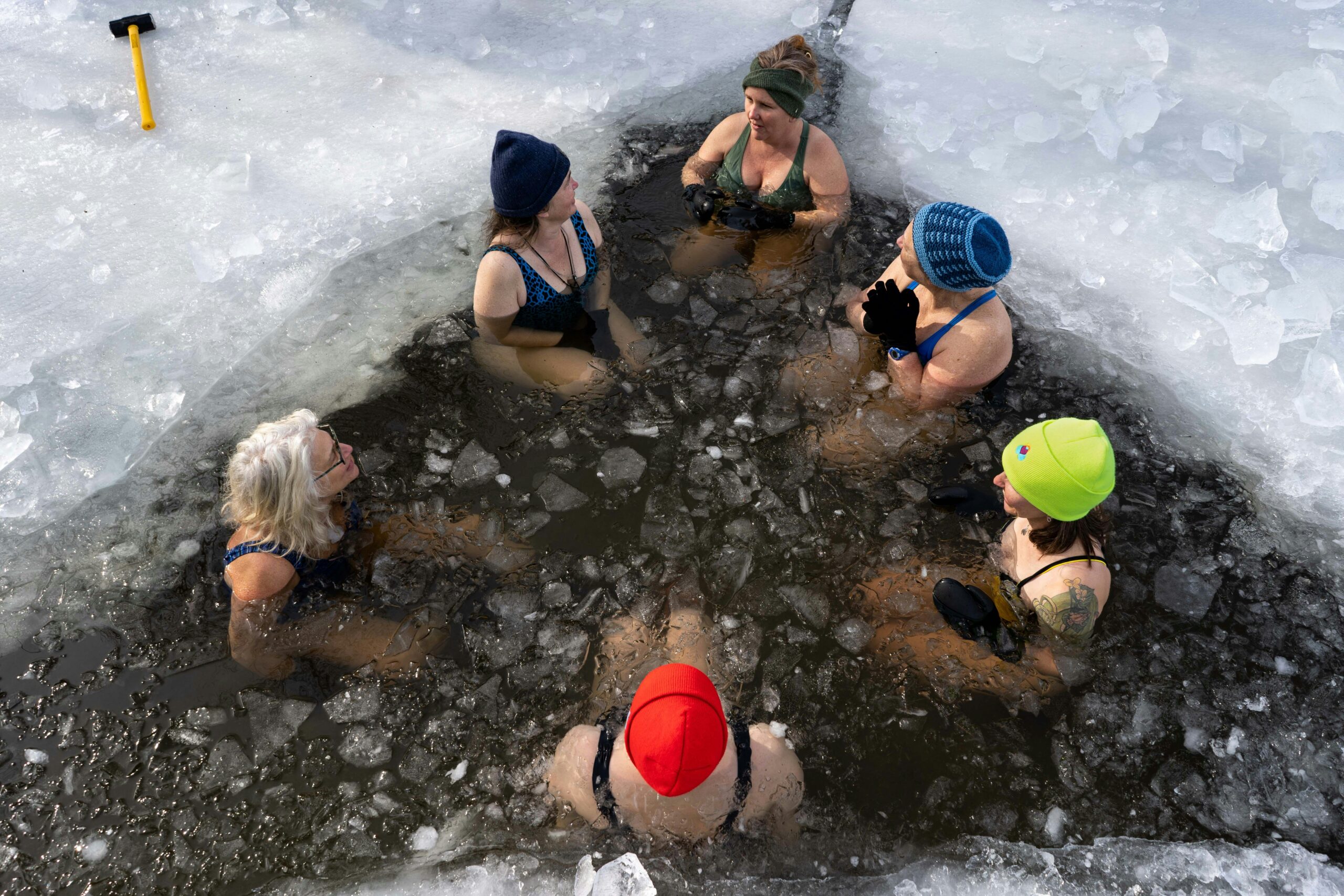 People outside experiencing an ice bath