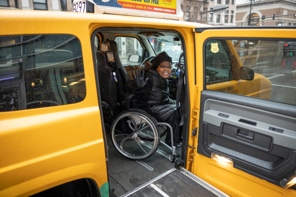 Wheelchair user inside accessible vehicle