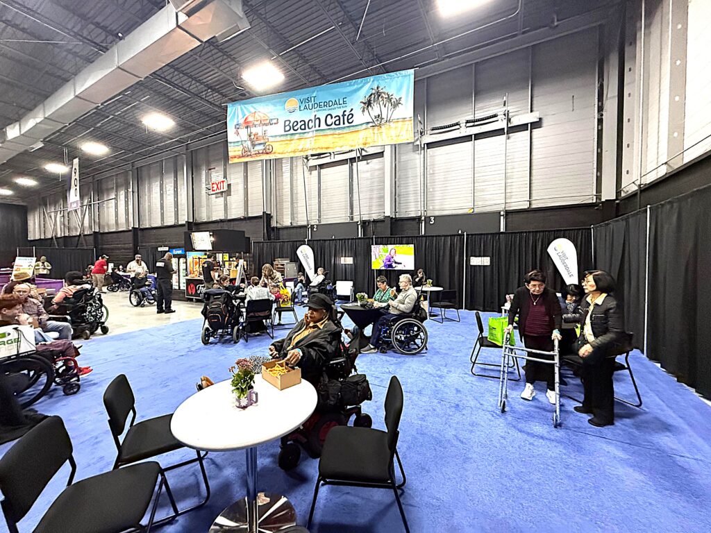 The Visit Lauderdale Beach Cafe is full of attendees taking a break from teh show floor.