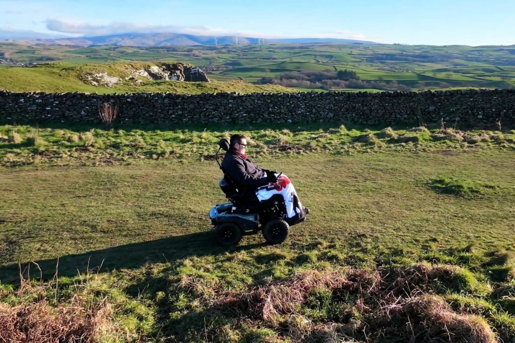 Nick Wilson rolling outside in the UK with the rolling hills in the background