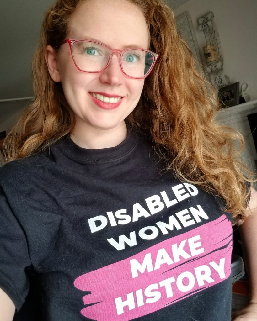 Stephanie Woodward in a shirt that says "Disabled Women make History"