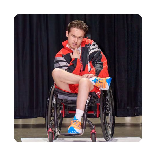 A model posing for the Runway of Dreams Fashion Show