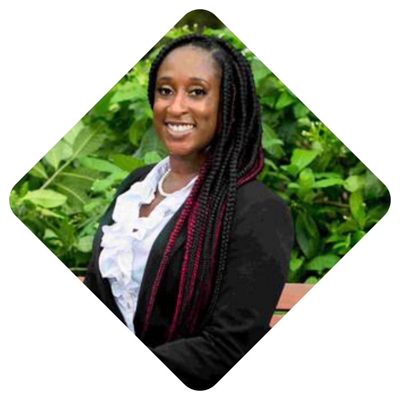 Photo of Attiya Atkins, sitting on a park bench