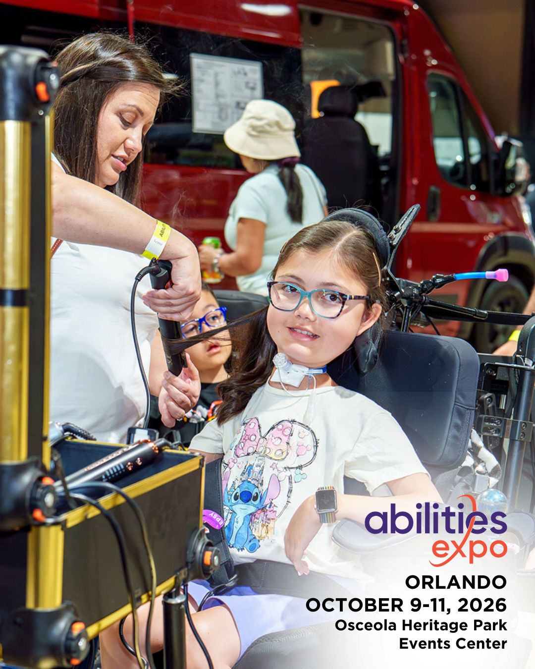 A young girl gets her hair curled at Abilities Expo. The bottom right corner reads "abilities expo, Orlando, August 9-11, ORLANDO OCTOBER 9-11, 2026, Osceola Heritage Park Events Center."