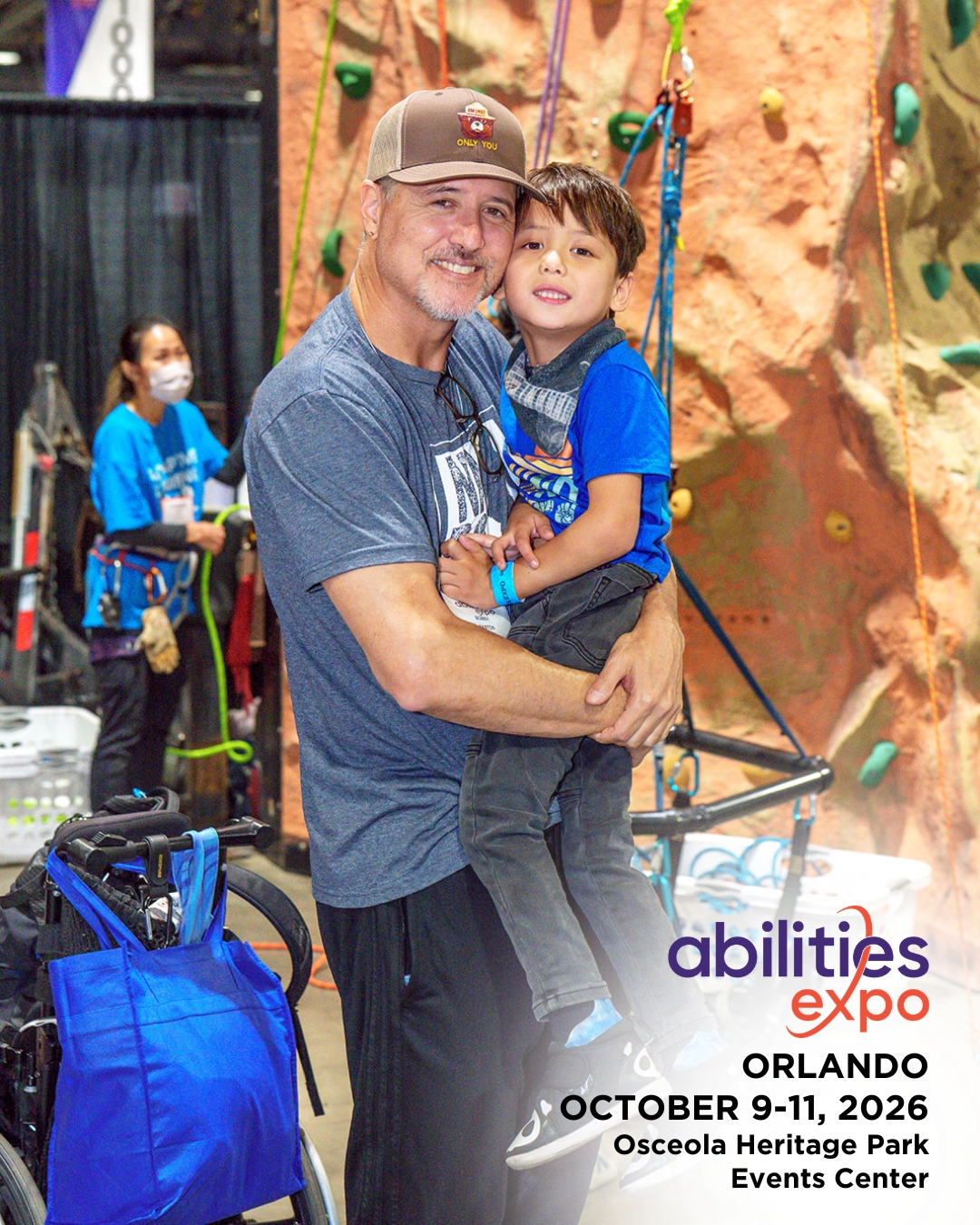 A father and son smile in front of the adaptive climbing wall. The bottom right corner reads "abilities expo, Orlando, August 9-11, ORLANDO OCTOBER 9-11, 2026, Osceola Heritage Park Events Center."