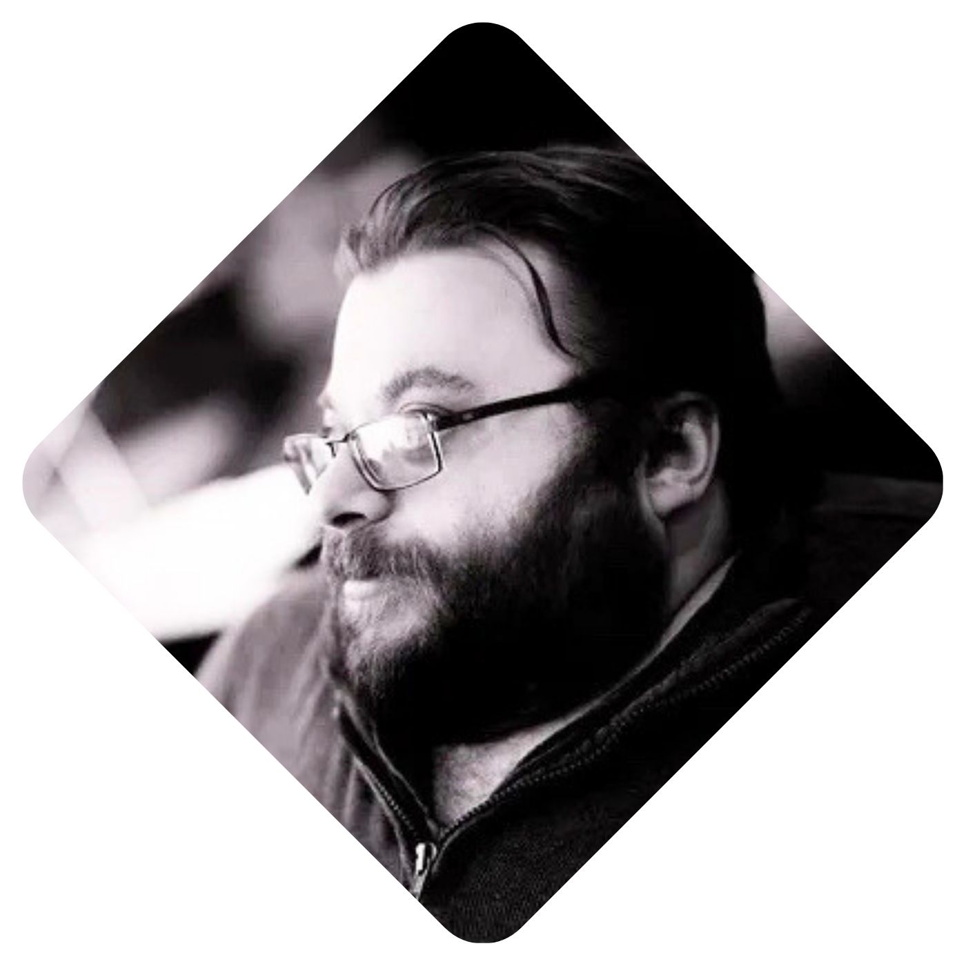 A black and white headshot of Thomas Quiter.